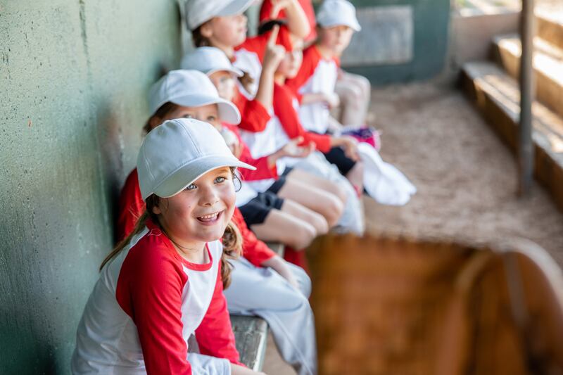 Youngsters in elementary school from a co-ed Little League baseball team. Photograph: Courtney Hale/Getty