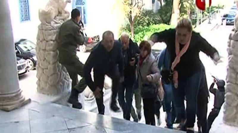 In an image grab taken from the state-run Tunisia 1 channel,  people run to escape from the Bardo museum during the attack. Photograph Tunisia 1/AFP Photo