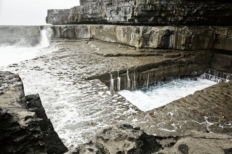 Poll na bPéist (the Wormhole): wild swimmers often have the natural pool to themselves at high tide on Inis Mór