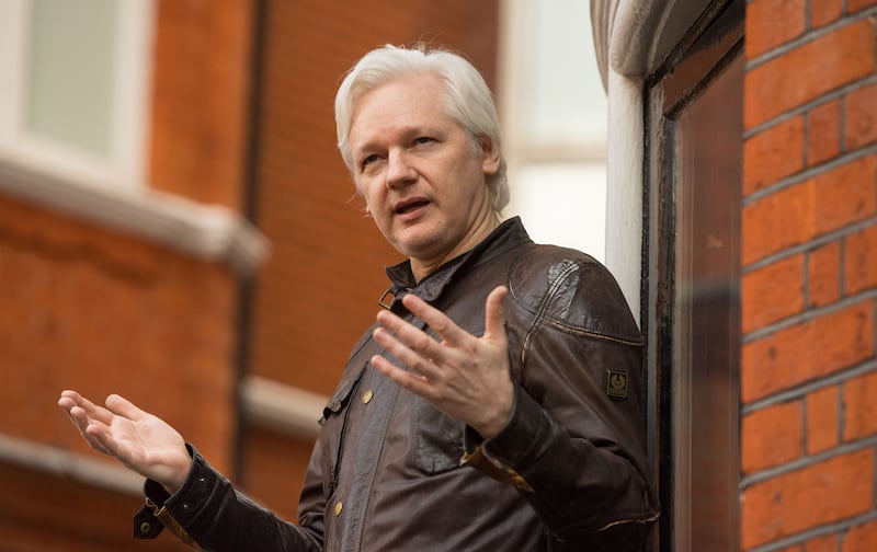 Julian Assange speaking from the balcony of the Ecuadorian embassy in London in 2017. Photograph: Dominic Lipinksi/PA