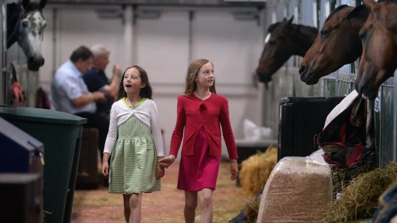 Hannah and Emma Mackey from Waterford strolling in the stall during the Discover Ireland Dublin Horse Show at the RDS. Photograph: Cyril Byrne