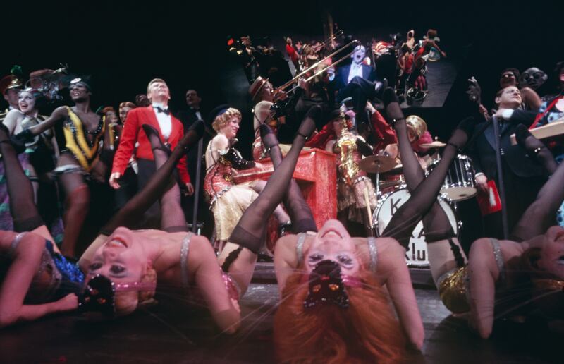 American actor Joel Grey (rear centre, in black tuxedo) and cast in a scene from Broadway musical Cabaret in 1966. Photograph: Mark Kauffman/Getty Images