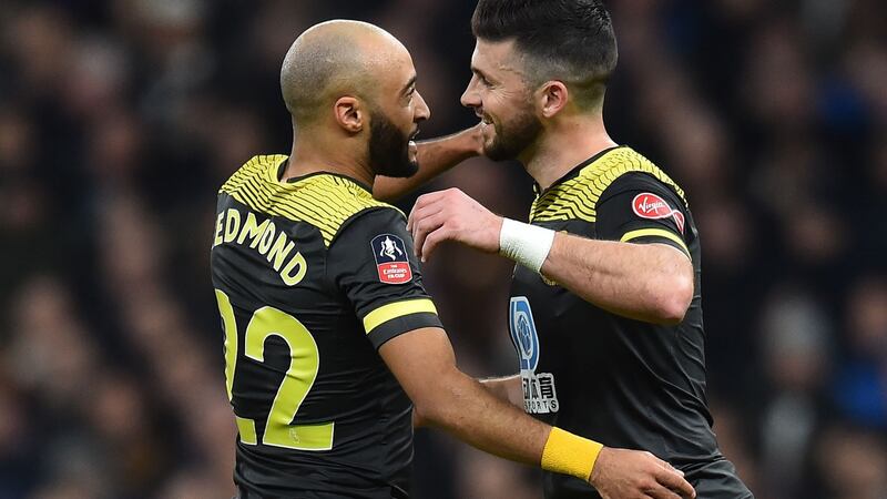 Southampton striker Shane Long  celebrates scoring his goal with Nathan Redmond during the FA Cup fourth-round replay against Tottenham Hotspur at Tottenham Hotspur Stadium. Photograph:   Glyn Kirk/AFP via Getty Images