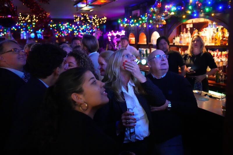 Supporters of Geert Wilders reacting to an exit poll and early results that strongly indicate a victory for his party in the Dutch elections. Photograph: Carl Court/Getty Images