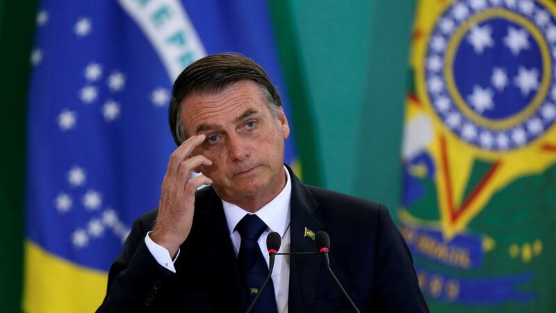 Brazil’s president Jair Bolsonaro: Threatened to cancel regulations protecting the Amazon rainforest and its indigenous inhabitants. Photograph: Adriano Machado/Reuters