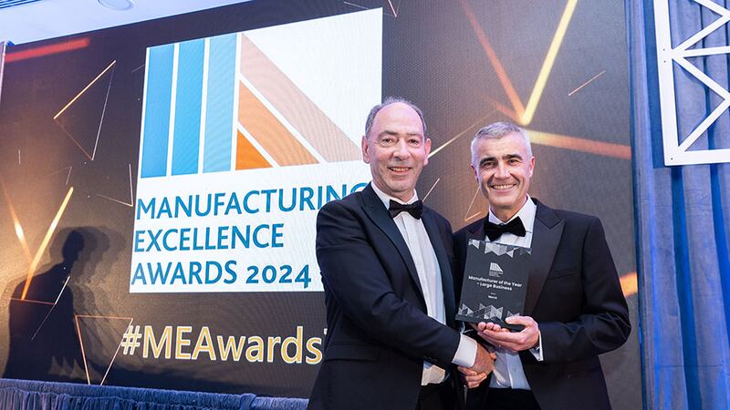 Denis Dowling, full professor, School of Mechanical and Materials Engineering, University College of Dublin presents the manufacturer of the year – large business award to Mark Dunphy, Merck