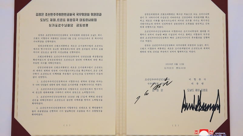 A photo released by the official North Korean Central News Agency (shows agreement signed by Korean leader Kim Jong Un and US president Donald J Trump. Photograph: KCNA