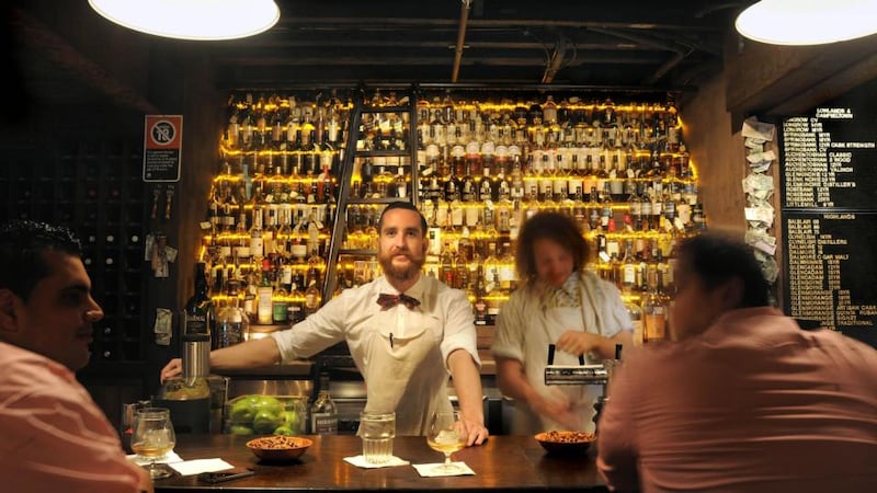 Baxter Inn, a dimly lighted saloon with vintage boxing posters on the walls and hundreds of fine whiskeys lined up behind the bar.