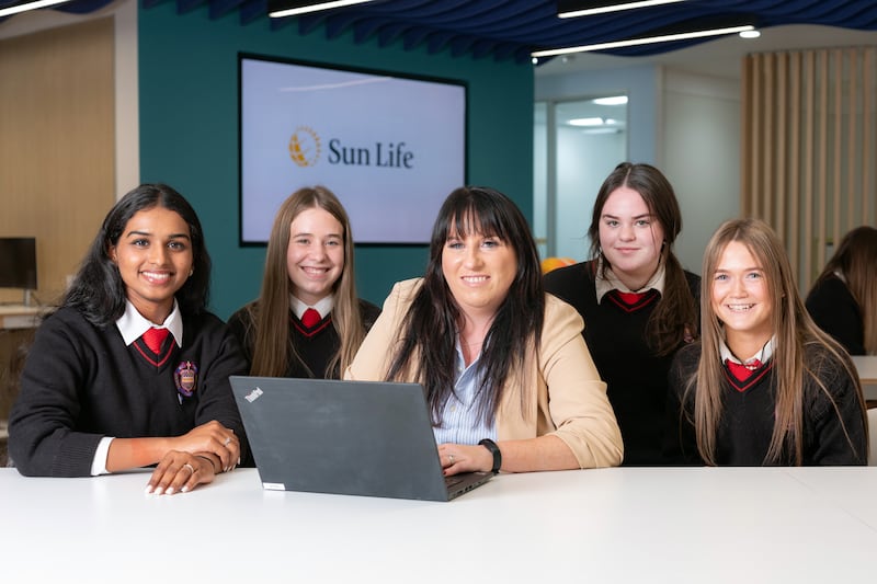 Sun Life's Donna Clements, centre, acts as a mentor for secondary school students on the Stem Passport for Inclusion