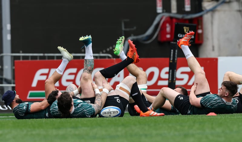 Jamison Gibson-Park, Andrew Porter and Dan Sheehan limber up in advance of the Italy fixture. Photograph: Billy Stickland/Inpho