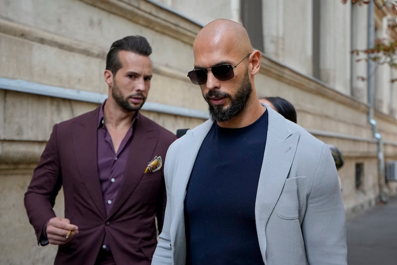 Andrew Tate (right) and his brother Tristan outside the court of appeals. Photograph:  Vadim Ghirda/AP