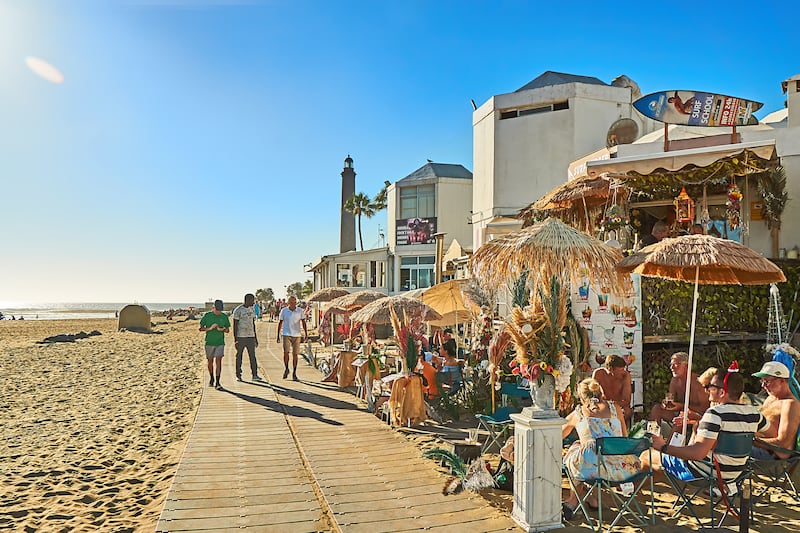 An winter promenade on the boardwalk at Maspalomas, Gran Canaria