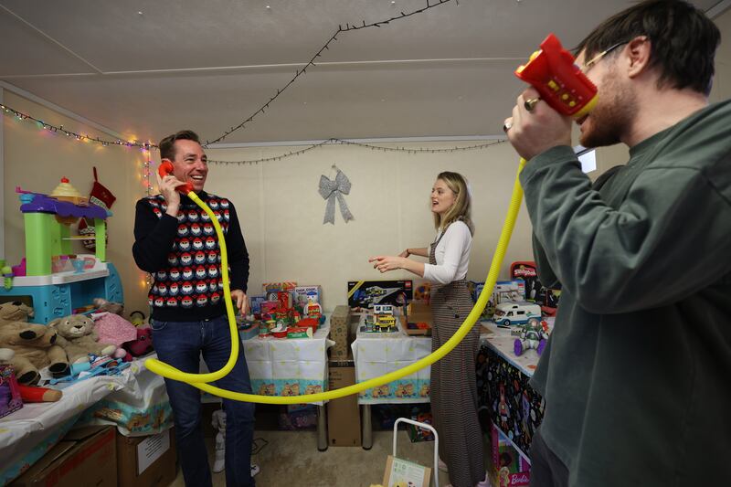 Ryan Tubridy with toy researchers Sinead McMullen and Andrew McDermott. Photograph: Nick Bradshaw 