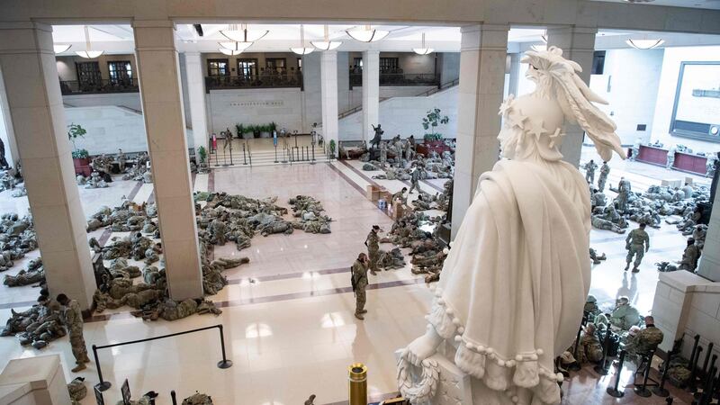 Members of the National Guard rest in the Capitol visitors centre on Capitol Hill in Washington, DC on Wednesday. Photograph: Saul Loeb/AFP via Getty