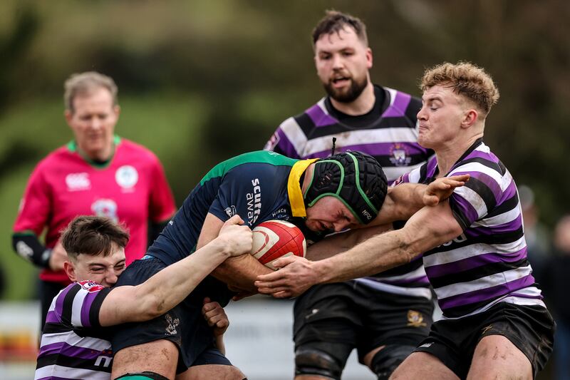 Ballynahinch's Marcus Rea comes up against Colm de Buitléar of Terenure College. Photograph: Ben Brady/Inpho 