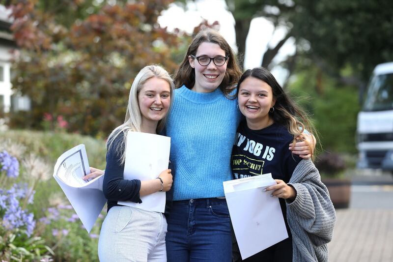 SISTERLY: Katie Grassick, Ballybrack, Dublin; Lucy Fitzsimons, Greystones, and Katie Ecock, Blackrock, Dublin, celebrate their results at Rathdown School, Glenageary, Co Dublin. Photograph: Justin Mac Innes/Jason Clarke Photography