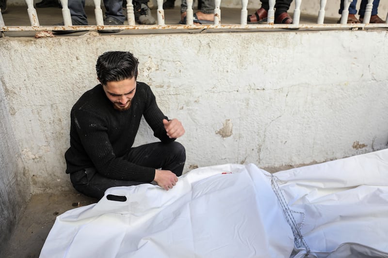 A Palestinian man mourns over the body of a loved one at the Ahli Arabi hospital in Gaza City. Photograph: AFP/Getty 