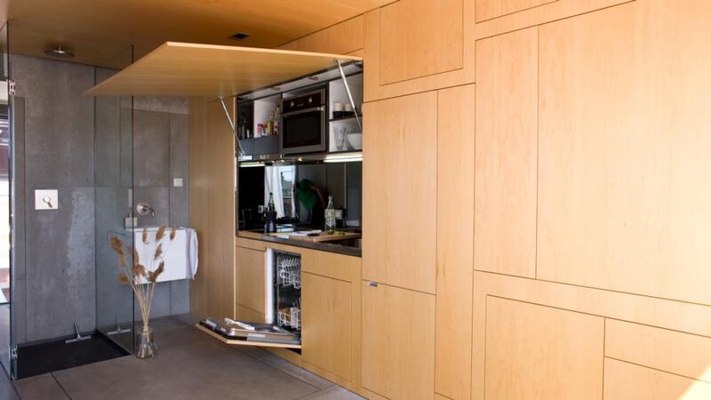 A hideaway kitchen cabinet in the penthouse in Barcelona