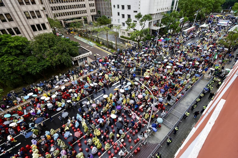 Demonstrators gather during a protest against three bills proposed by Taiwan's opposition parties, outside the Parliament building in Taipei, Taiwan. Photograph: Richie B Tongo/EPA-EFE