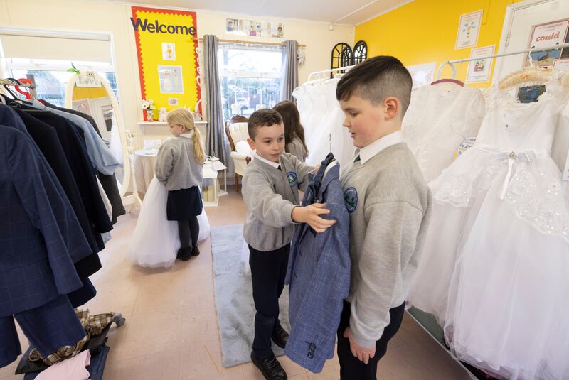 Fourth class pupils Odhran McCallion and Eric Ward at the Communion wear pop-up shop in Sacred Heart Primary School, Derry. Photograph: Joe Dunne