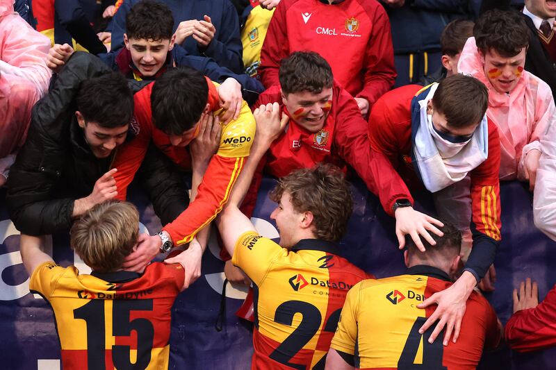 St Fintan's High School players celebrate with supporters after the win over Castleknock College. Photograph: Bryan Keane/Inpho