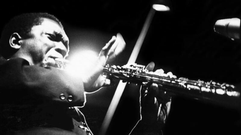 ‘Making lunch with John Coltrane playing makes it feel like a proper Sunday’:  John Coltrane performs on stage at the Half Note club, New York in 1965. Photograph: Adam Ritchie/Redferns