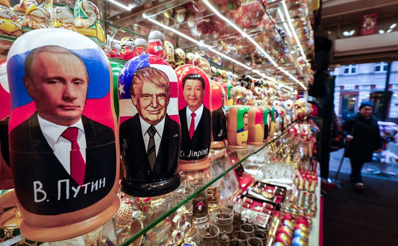 Traditional Russian Matryoshki dolls depicting Vladimir Putin, Donald Trump and Xi Jinping on display at a gift shop in Moscow. Photograph: Yuri kochetkov/EPA-EFE