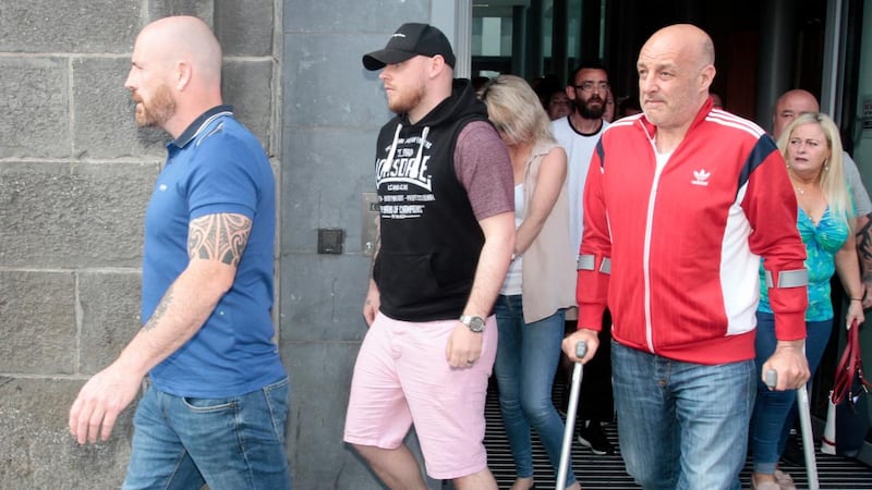 Kevin Sheehy snr, left, and supporters on their way out of Wednesday’s court hearing in Limerick. Photograph: Brendan Gleeson