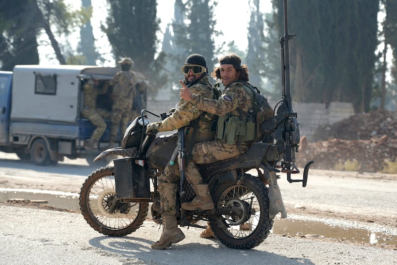 Jihadists drive on the international M5 highway in the area Zarbah  which was taken over by anti-government fighters on Friday, as Hayat Tahrir al-Sham jihadists and allied factions continue their offensive in Syria's northern Aleppo province against government forces. Photograph: Rami al Sayed/AFP