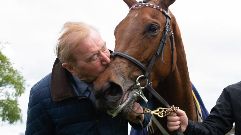 Trainer Dermot Weld gives a kiss to Homeless Songs after her win in the Tattersalls Irish 1,000 Guineas at the Curragh. Photograph: Tom Maher/Inpho