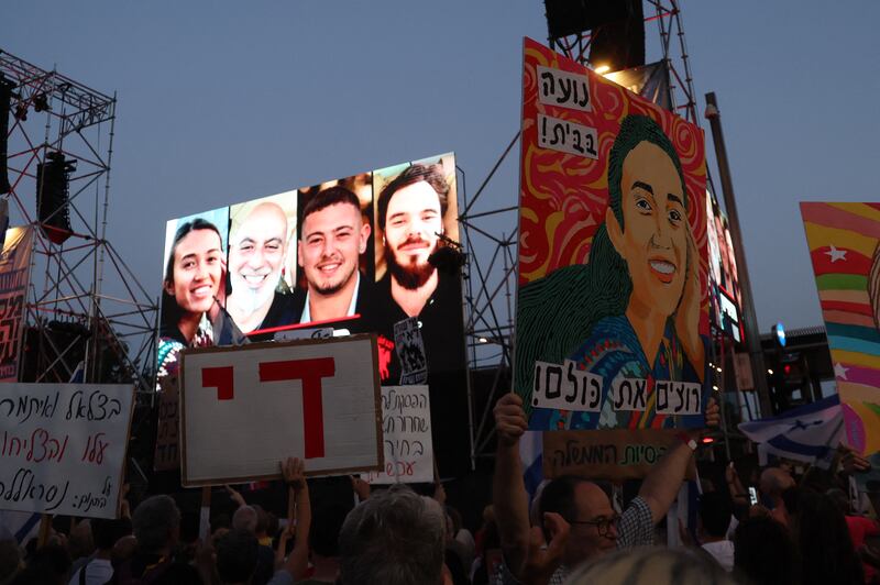 A billboard depicting from left: Noa Argamani, Shlomi Ziv, Almog Meir Jan and Andrey Kozlov, the four Israeli hostages rescued by the Israeli army. Photograph: Jack Guez/AFP