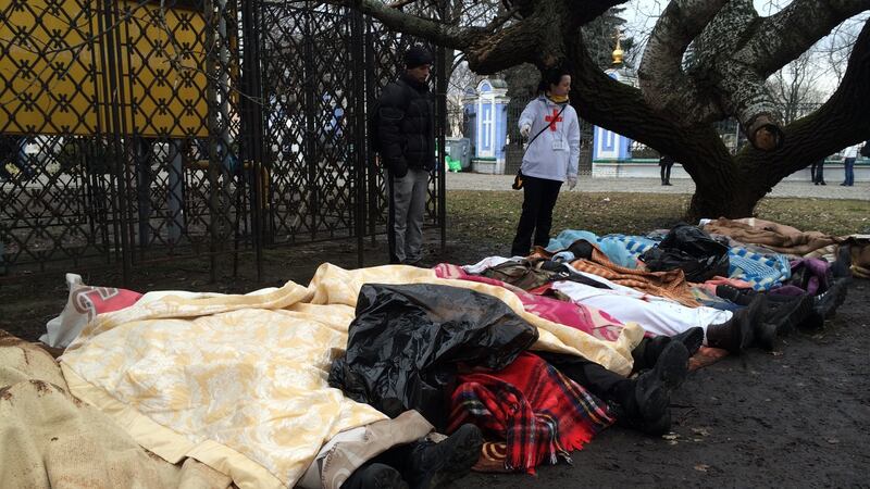 The bodies of anti-government protesters shot dead on Kiev’s Maidan square were brought to the grounds of St Michael’s monastery on February 20th, 2014. When fellow protesters identified the dead, their names were written on their legs in felt-tip pen