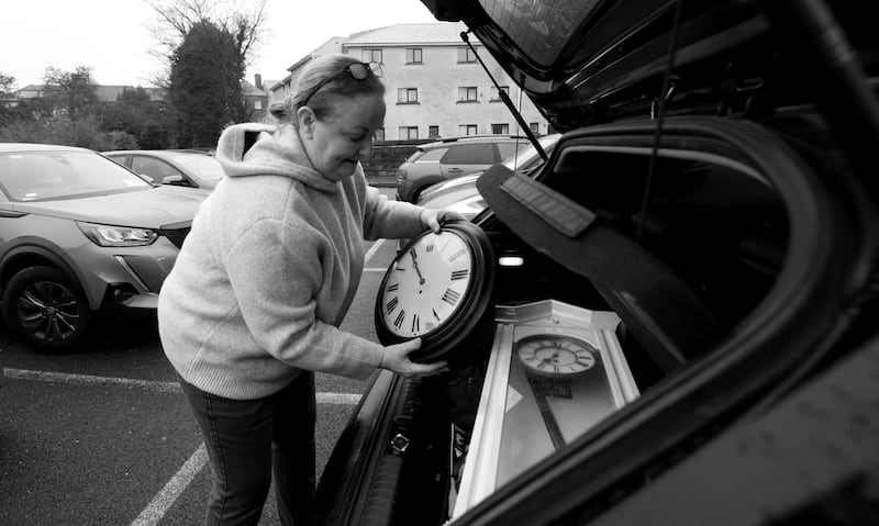 Mary Lou Fagan from Newbridge brings her recently purchased clocks back to her car