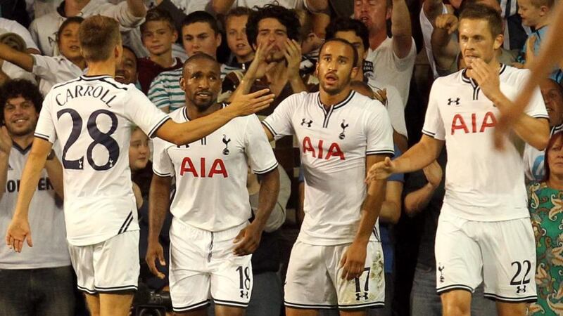 Jermain Defoe (second left) celebrates his  second goal with team-mates at White Hart Lane.  Photograph: Sean Dempsey/PA Wire