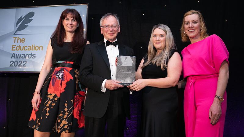 Prof. Willie Donnelly, Awards Judge, presents the Excellence in the Provision of Professional Services Award to the University of Limerick team.