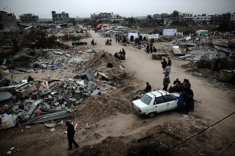  Palestinians inspect the Israeli-bombed Zeitun district of Gaza City in the aftermath of  Operation Cast Lead. Photograph: Olivier Laban-Mattei/AFP via Getty Images