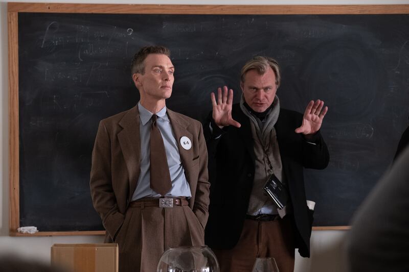 Cillian Murphy (as J Robert Oppenheimer) and writer, director, and producer Christopher Nolan on the set of Oppenheimer. Photograph: Melinda Sue Gordon/Universal Pictures