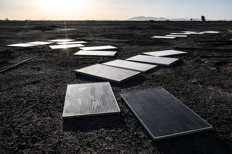 Some of the many solar panels that once powered water pumps enabling southwest Afghanistan’s arid Bakwa district to briefly become a hub of the global narcotics trade, now readied for transport elsewhere on April 22nd, 2023. The Bakwa’s drug trade was once permitted and taxed by the Taliban. Now it is forbidden again, but another factor had already taken a toll: the water is running out. Photograph: Bryan Denton/The New York Times
                      