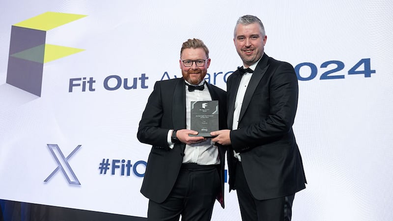 Michael Kelly, sales director of Etag, presents the fit out sub-contractor of the year award to Emmet McKenna, Truwood