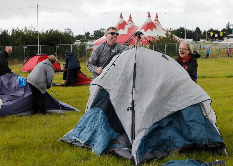 Michael Duggan and Jeanette Duggan from Mullinavat, Co Kilkenny, brave the elements at Forever Young. Photograph: Alan Betson 

