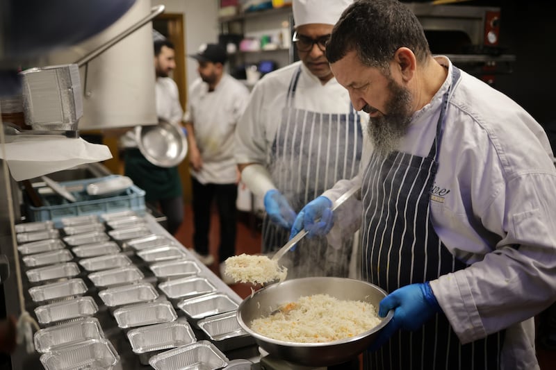 Ismail Benarab, owner of the Golden Olive restaurant in Clonskeagh, prepares 60 chicken dinners at a steep discount for the Muslim Sisters of Éire soup kitchen for the needy on Fridays. Photograph: Chris Maddaloni