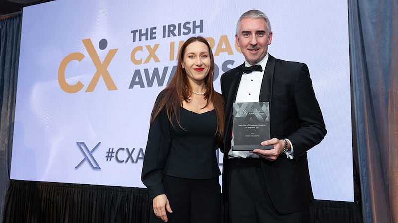 Agnieszka Jozwiak, awards judging coordinator, presents the best use of customer insights to improve CX award to Paul Allen, Allied Irish Banks