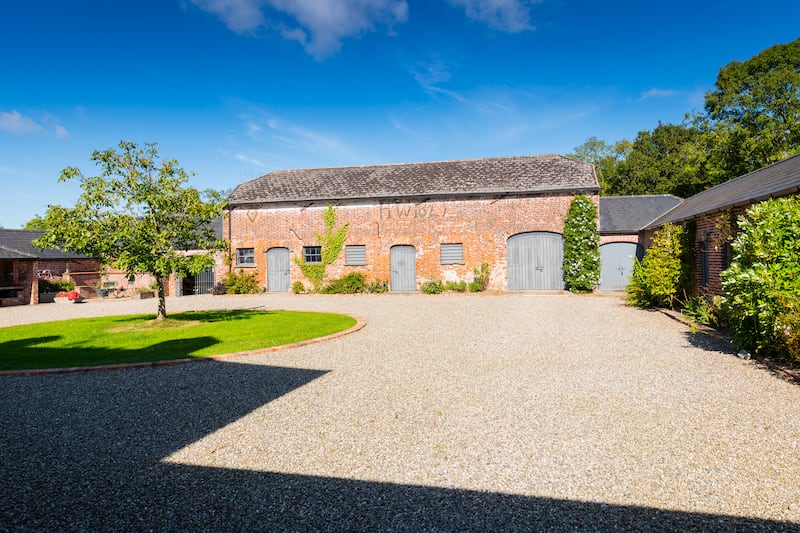 Clonganny House: Each of the house’s four courtyard suites, with bedrooms and sitting areas, open on to private patios within the walled garden, close to the woods.