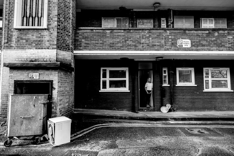 Sireena at substandard housing in Hackney, London. "Sireena, who left Ireland due to experiencing racist abuse there, ended up living in some of the worst slum housing in London with literally everything in her flat being covered with mould. Three days after photographing that property the mould began to grow on my camera bag." Photograph: Marc Davenant