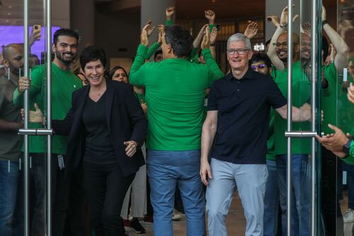 Apple signals iPhone push in India as Tim Cook opens first store