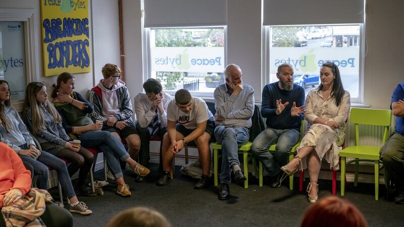 A reconciliation event organised by Eamonn Baker, with Lee Lavis, second from right, a former British soldier, and Fiona Gallagher, right, whose brother was killed by a British soldier, in Derry. Photograph: Andrew Testa/The New York Times