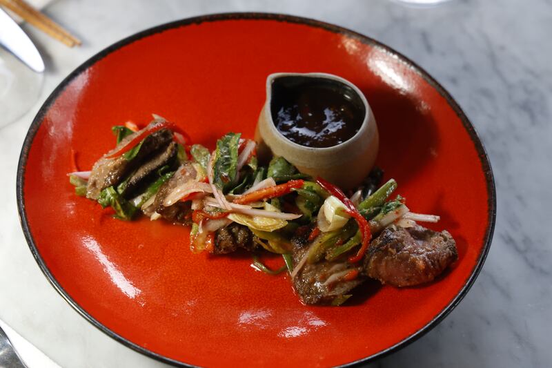 Indochine's 'Crying Tiger': marinated Irish beef fillet, red Nahm Jim, coriander and roasted rice, with tamarind dip. Photograph: Nick Bradshaw 