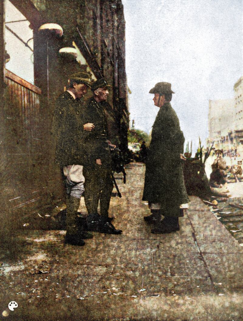 The photograph of the Pearse surrender in 1916 in which the legs and boots of nurse Elizabeth Farrell were frequently excised from the picture. Artist Sinead Guckian has turned the picture around and painted it from the nurse’s perspective