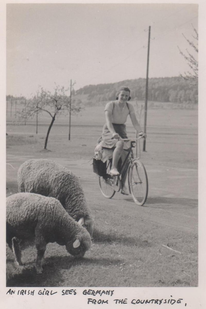 Dervla cycles past some sheep on a journey through Bavaria in 1952.