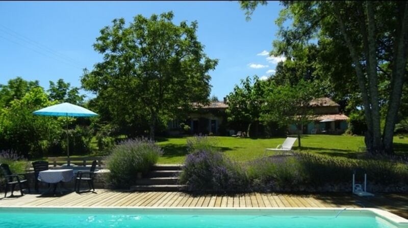 Dordogne in France: a three-bedroomed farmhouse and a two-bedroom guest house with  a lawn that runs down to a swimming pool